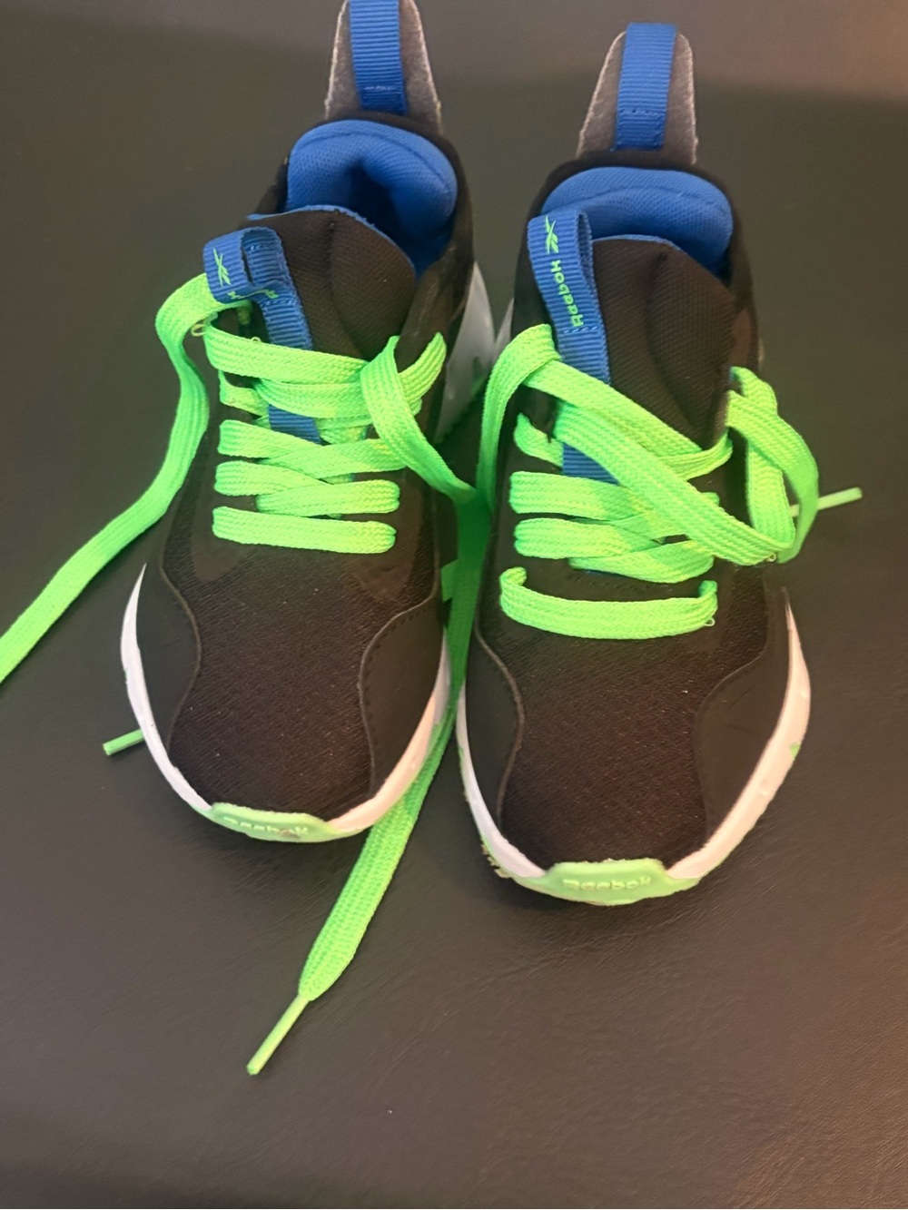 Reebok Black Kids Sneakers with Neon Green Laces and Blue Collar